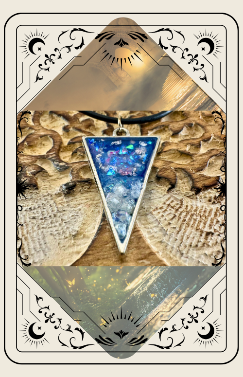 Triangular blue and white pendant necklace on a wooden background, set in an ornate cream-colored frame.