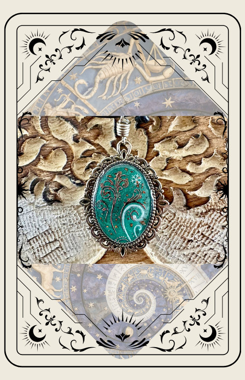 Emerald pendant with swirling white design on gold background, ornate frame design.