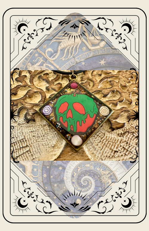 Tarot card with a poison apple pendant, green and red, gold background.