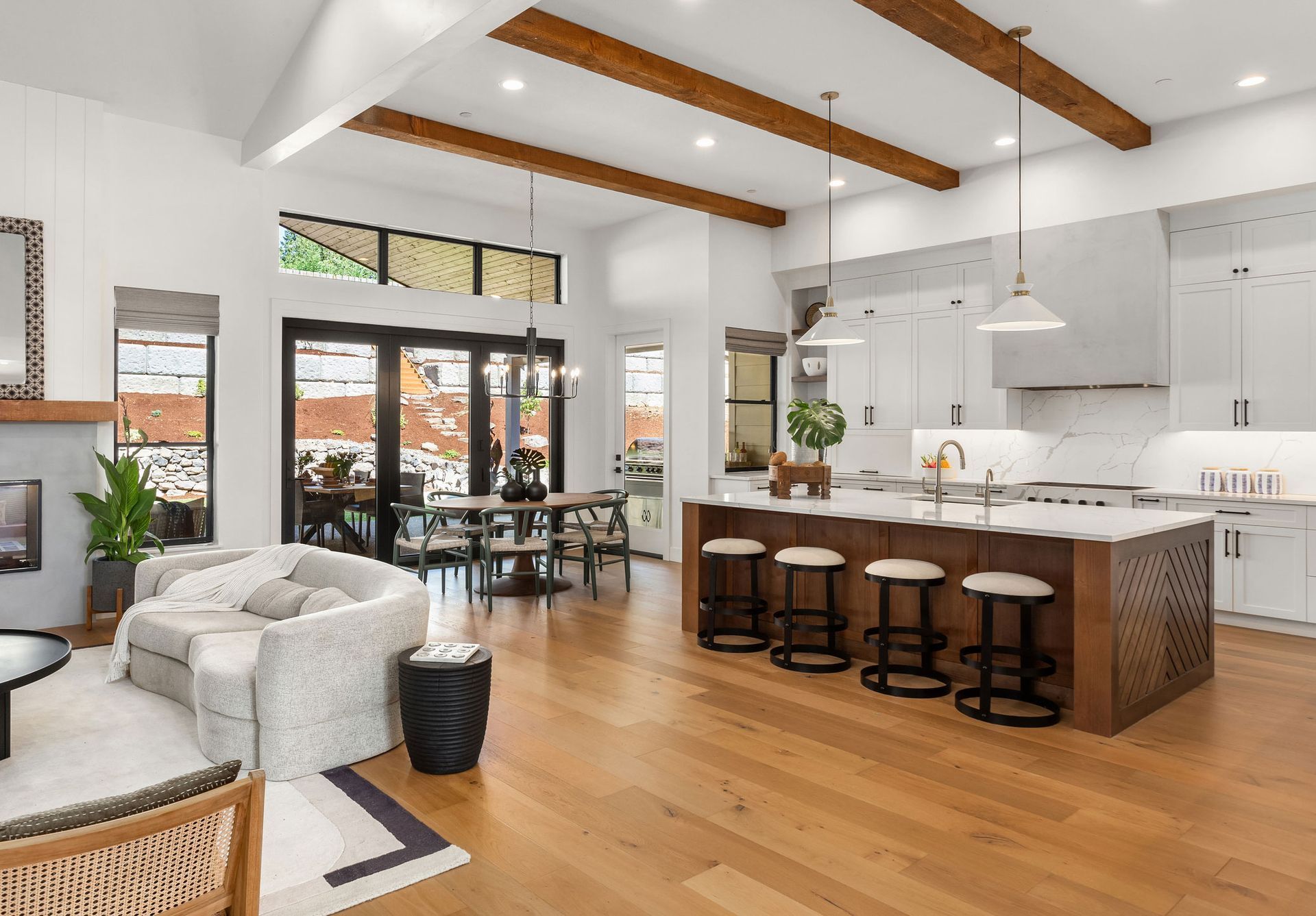 Kitchen and living room view with newly wood floor, showcasing wood flooring installation services