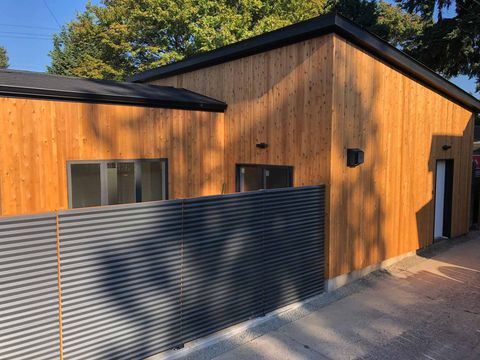 A Newly Built With A Black Metal Corrugated Fence — Mt. Holly, NJ — Gcapital Handyman Services LLC A Newly Built With A Black Metal Corrugated Fence — Mt. Holly, NJ — Gcapital Handyman Services LLC