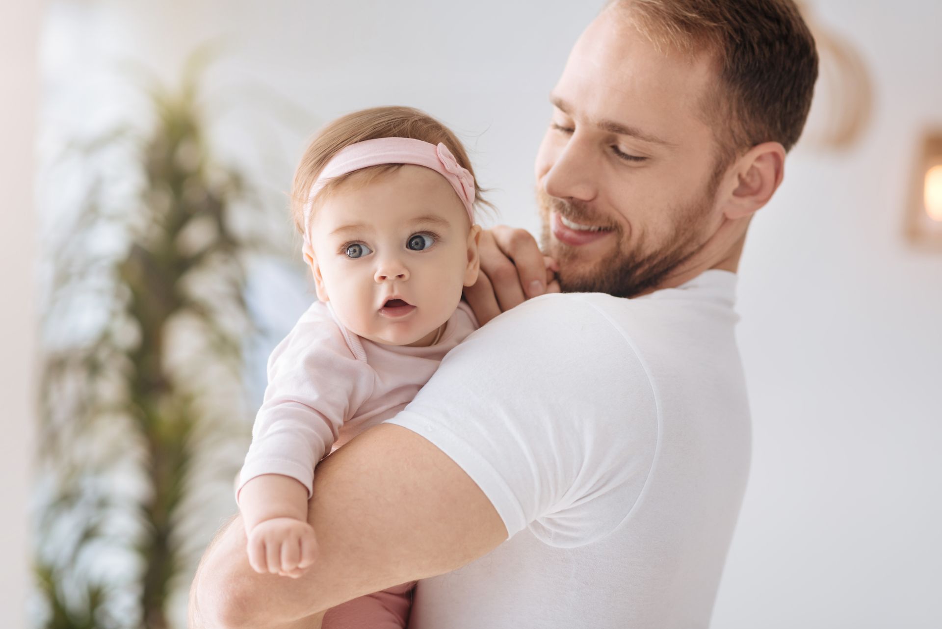 Father holding baby.
