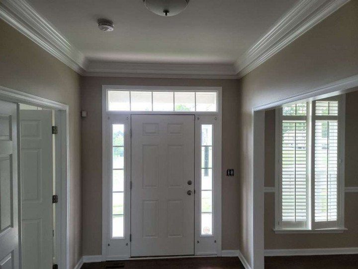 Foyer in Hatboro, PA, with newly painted doors, door frames, front door, sidelights, walls, and ceiling, creating a clean and polished entryway.