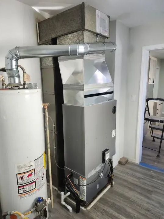Licensed HVAC technician inspecting a furnace for quality repair in Novi MI