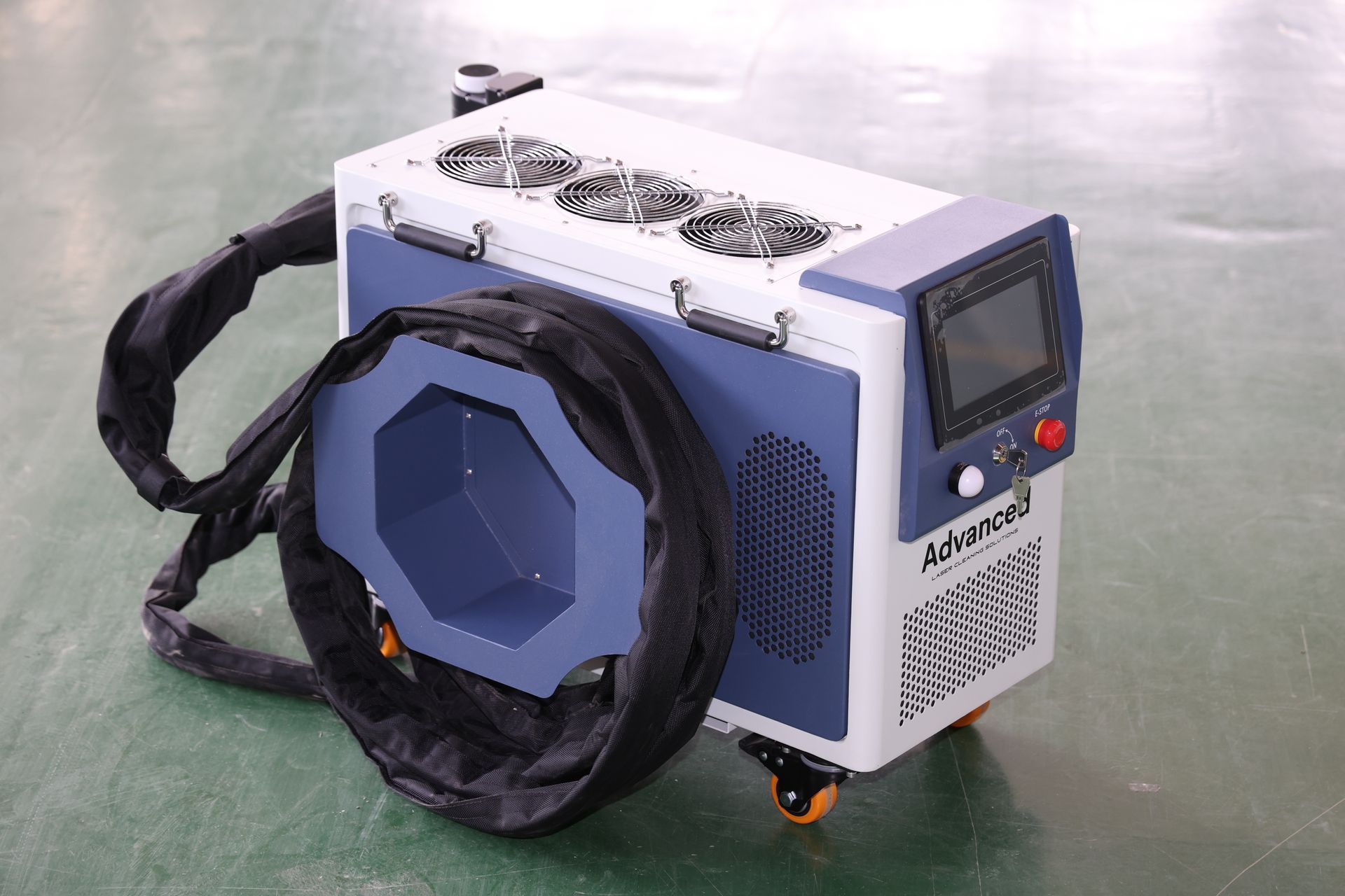Blue and white industrial machine with screen and cooling fans, on wheels.