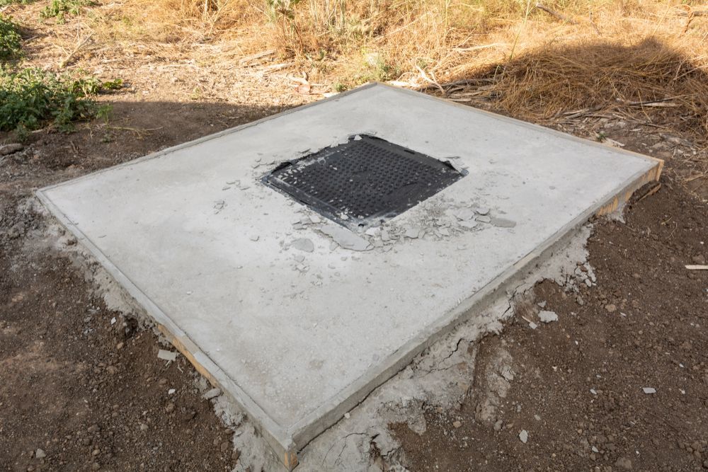 Concrete Square With a Central Metal Grate — Rob Powell Plumbing Pty Ltd in Coraki, NSW