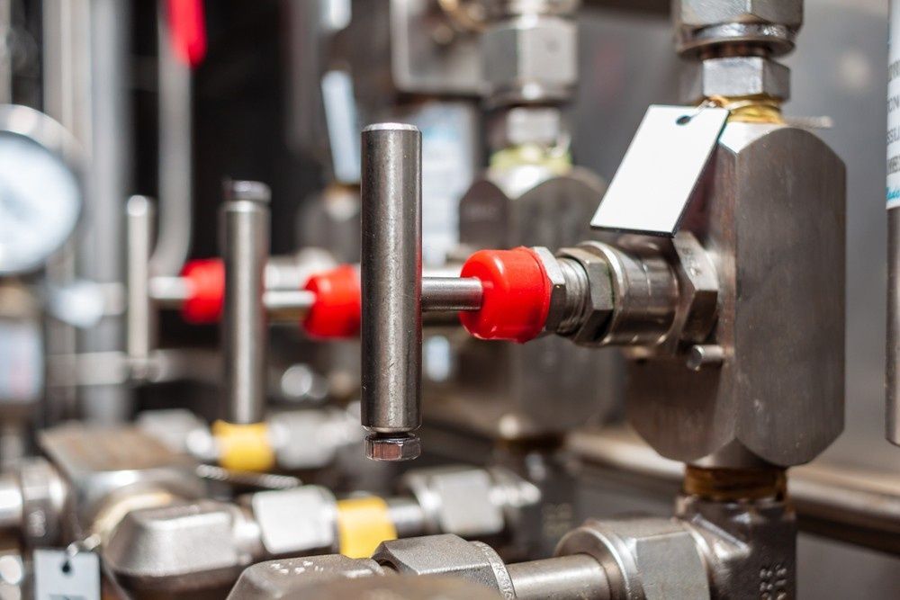 Close-up of Stainless Steel Valves With Red and Yellow Handles — Rob Powell Plumbing Pty Ltd in Casino, NSW