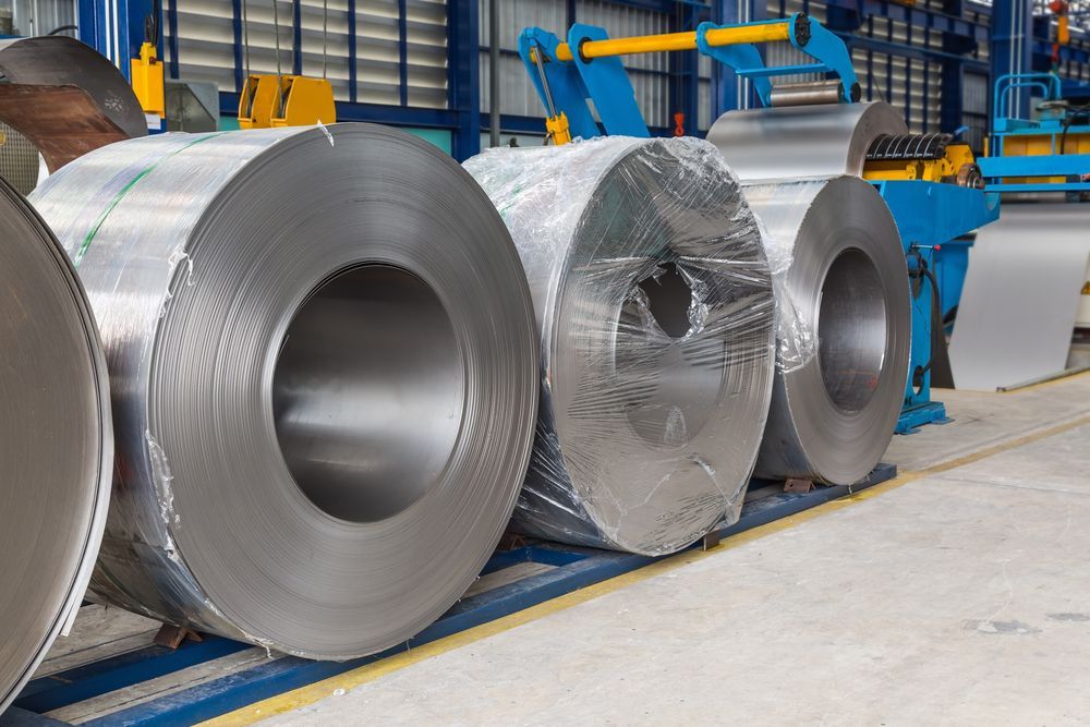 Large Rolls of Sheet Metal in an Industrial Setting — Rob Powell Plumbing Pty Ltd in Coraki, NSW