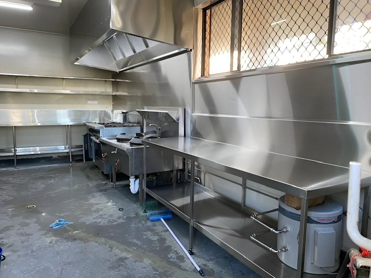 Stainless Steel Commercial Kitchen With Stovetop, Shelves, and Work Surfaces — Rob Powell Plumbing Pty Ltd in Coraki, NSW
