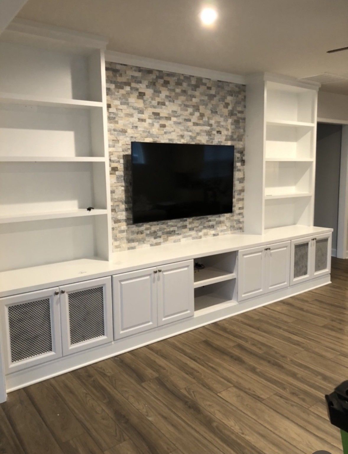 Modern living room wall with built-in white shelves | Decatur, IL