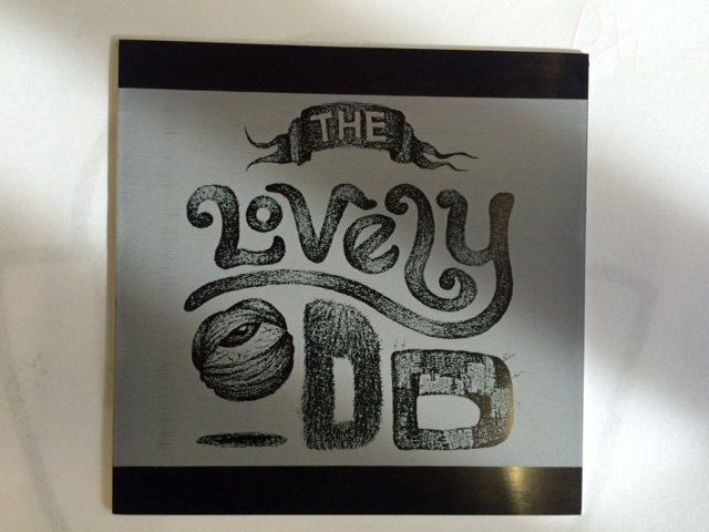 A black and white sign that says the very odd