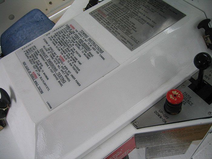 A white item with a warning label on it