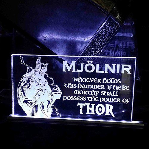A sign that says mjölnir whoever holds this hammer if he be worthy shall possess the power of thor.