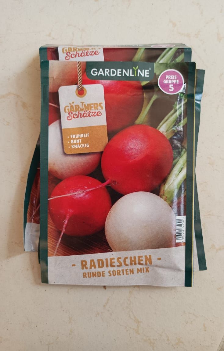 Radieschen seed packet with bright red radishes and green leaves on a light background
