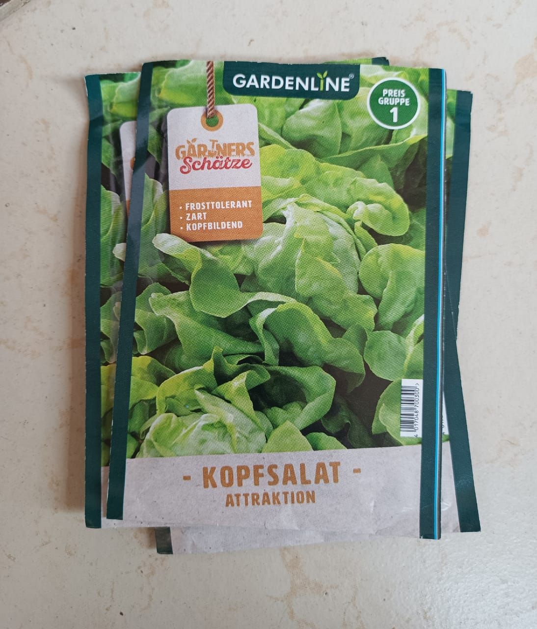 Seed packet for Gardenline lettuce, showing green leafy salad plants.