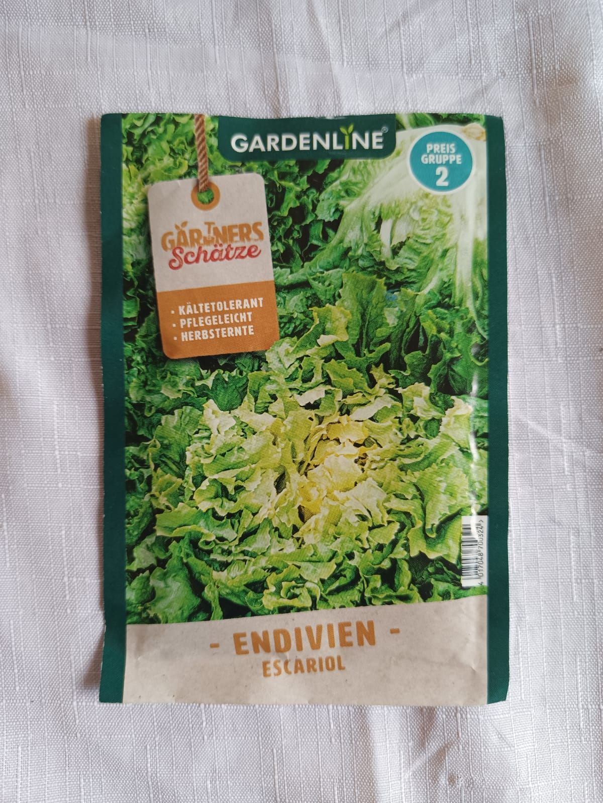 Gardeline endive seeds packet with green leafy vegetables pictured on the front