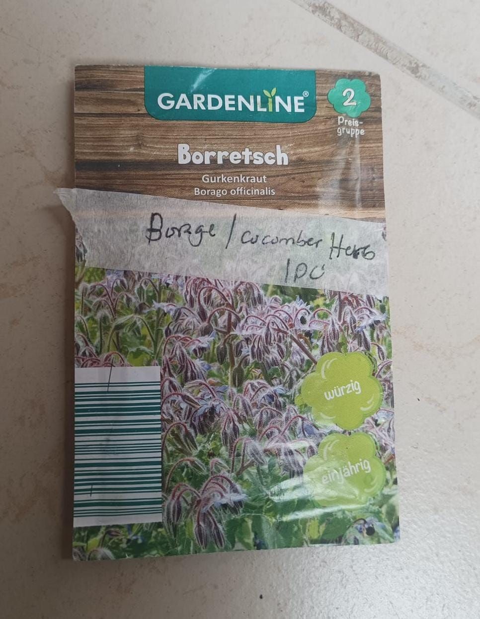 Gardening seed packet labeled “Borretsch” with purple-blue flowers and a green plant photo