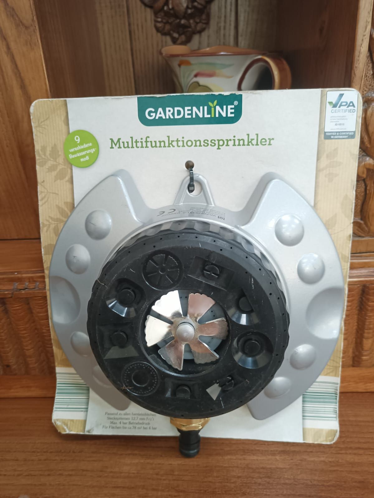 Gardenline multifunction sprinkler in black and gray on retail packaging