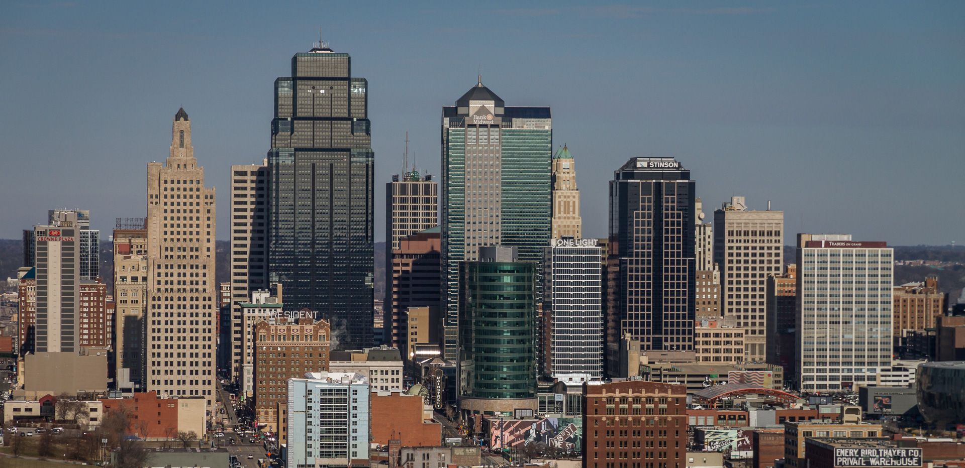 An aerial view of a city skyline on a sunny day