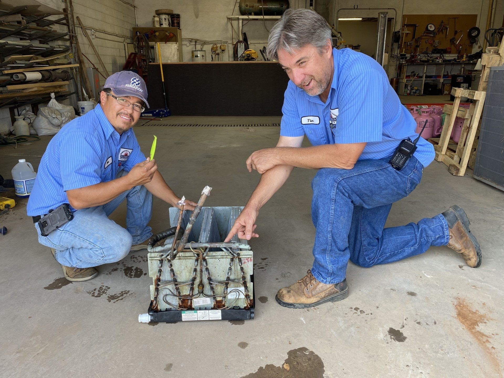 Fixing White Sink Pipe With Wrench — Levelland, TX — Robertson & Agnew Plumbing Heating & Air
