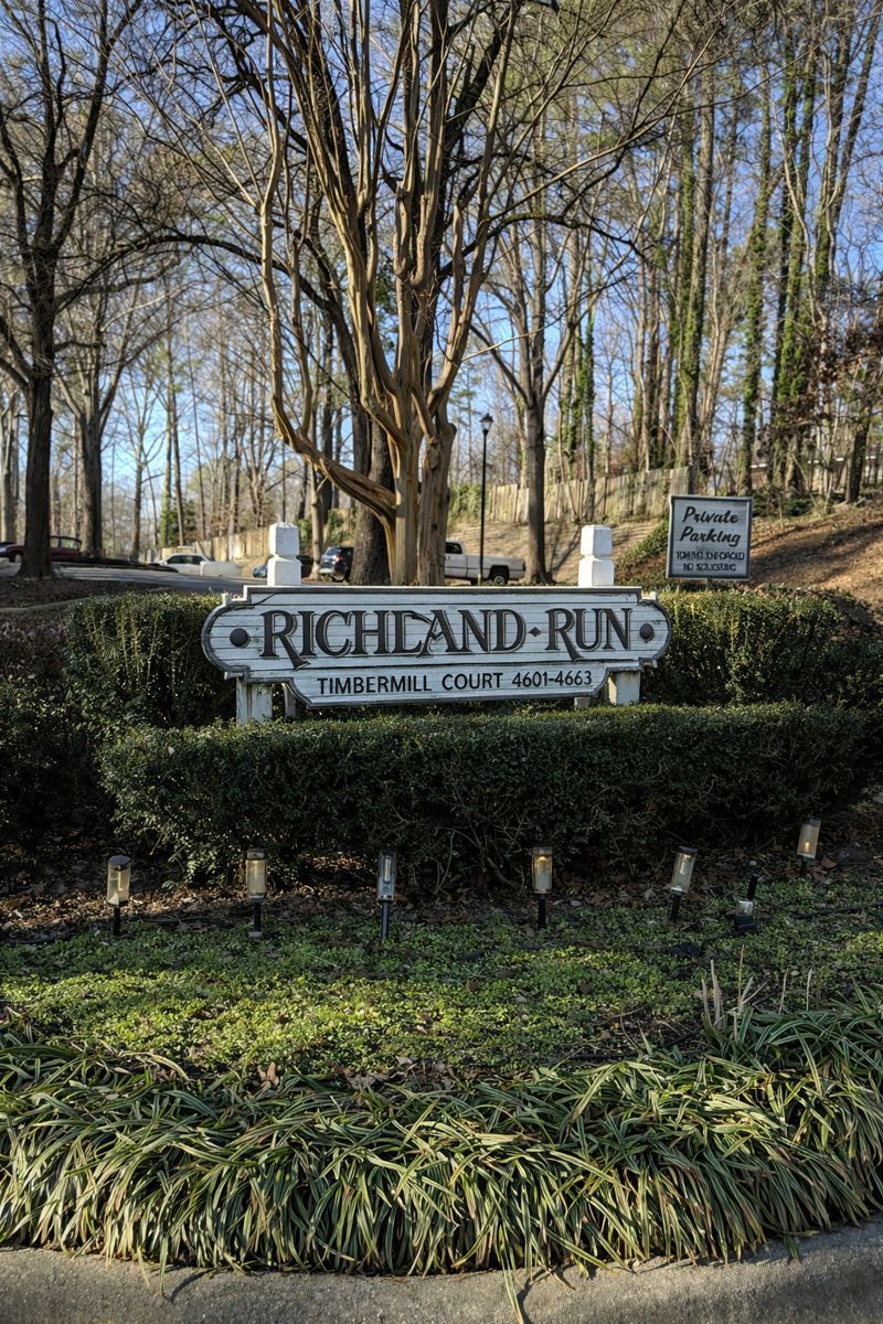 A white wooden sign reading