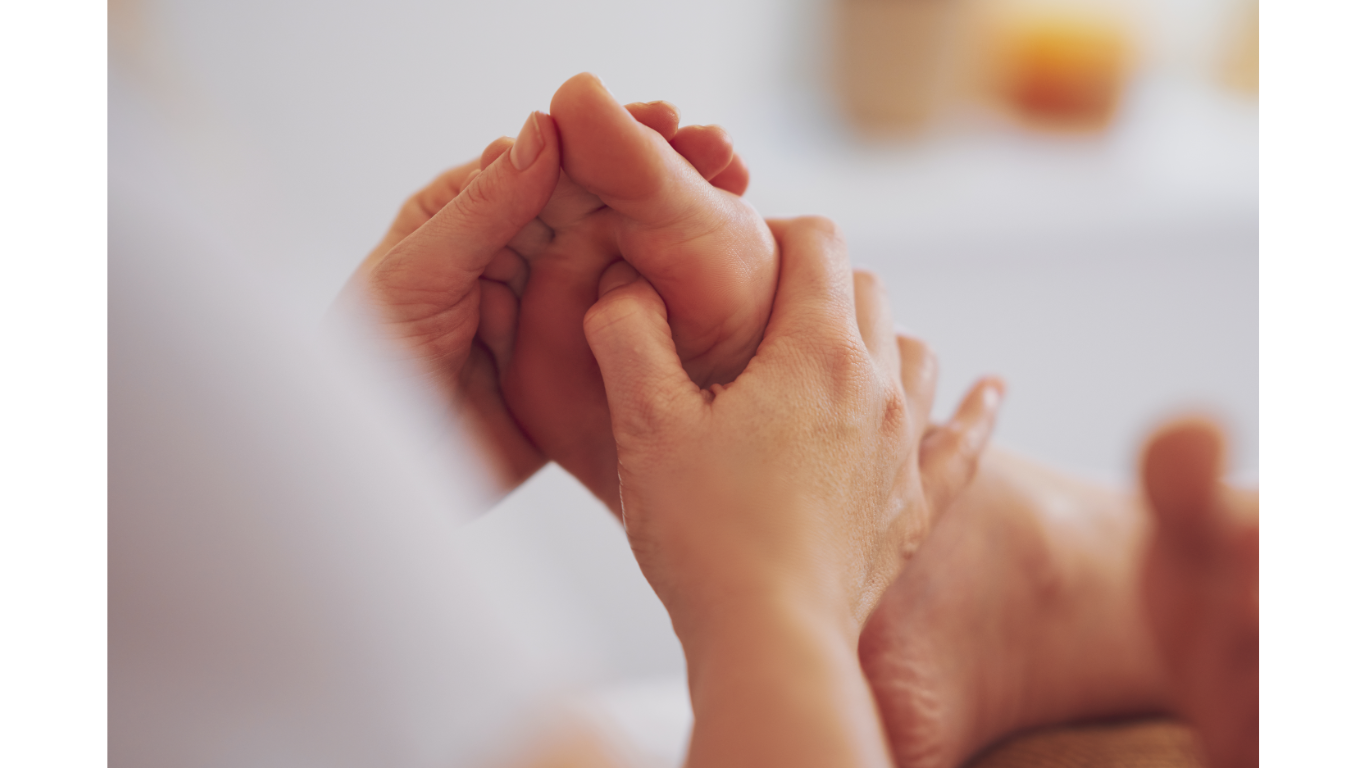 reflexologist treating foot 