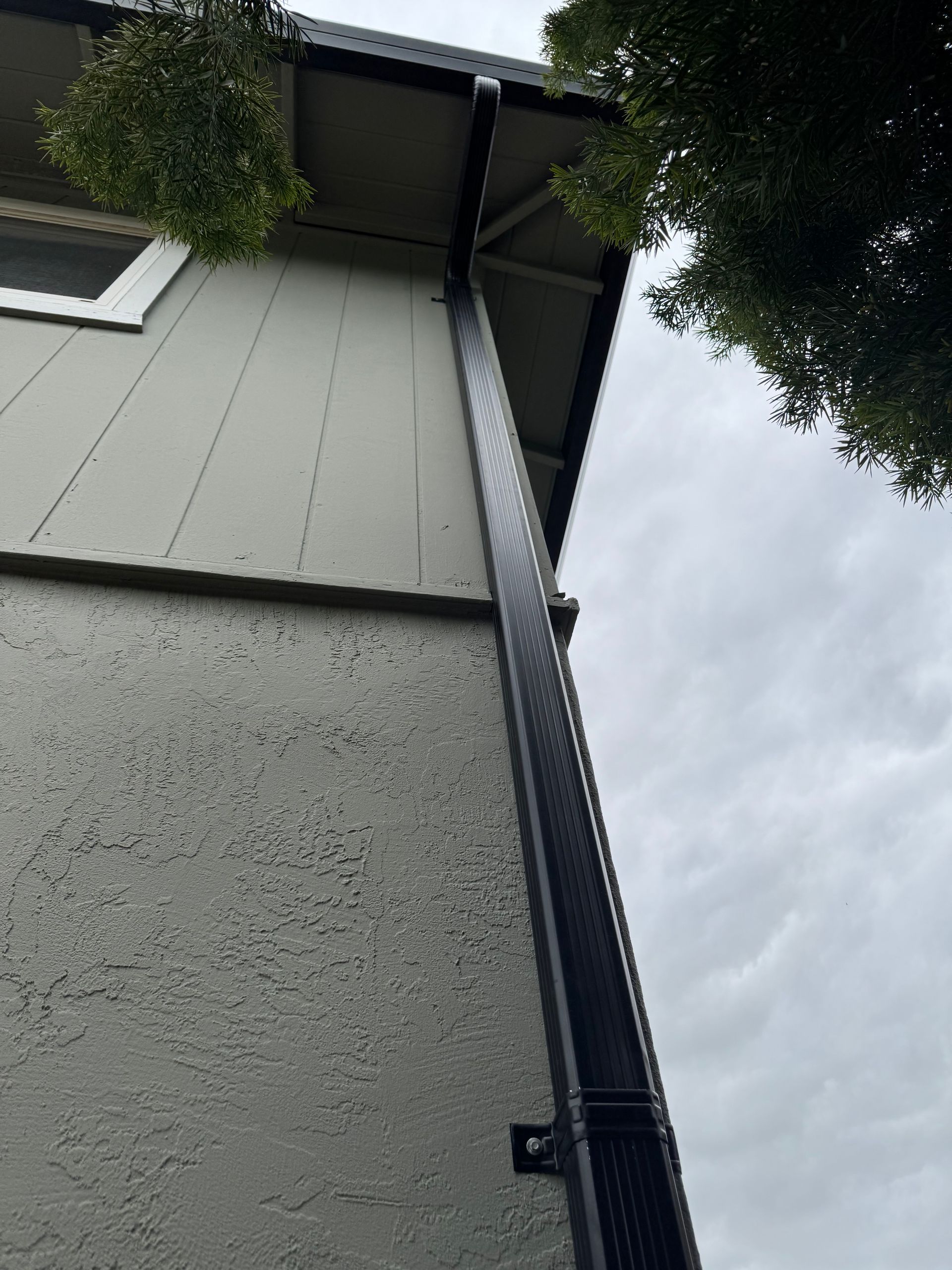 dark gutter downspout