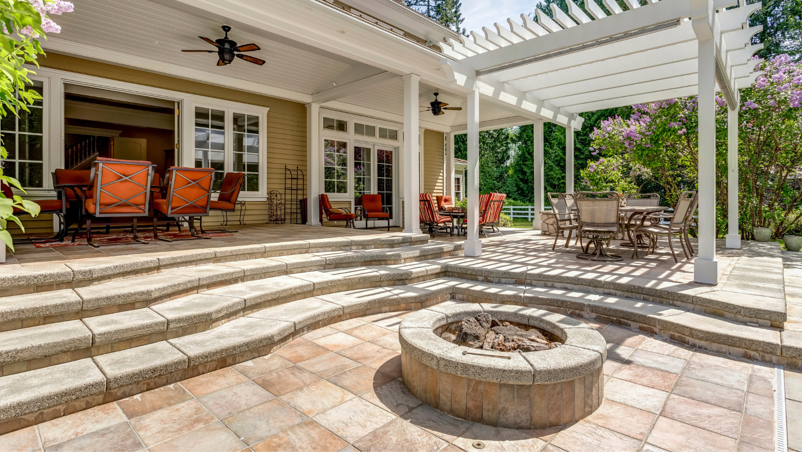 There is a fire pit in the middle of the patio.