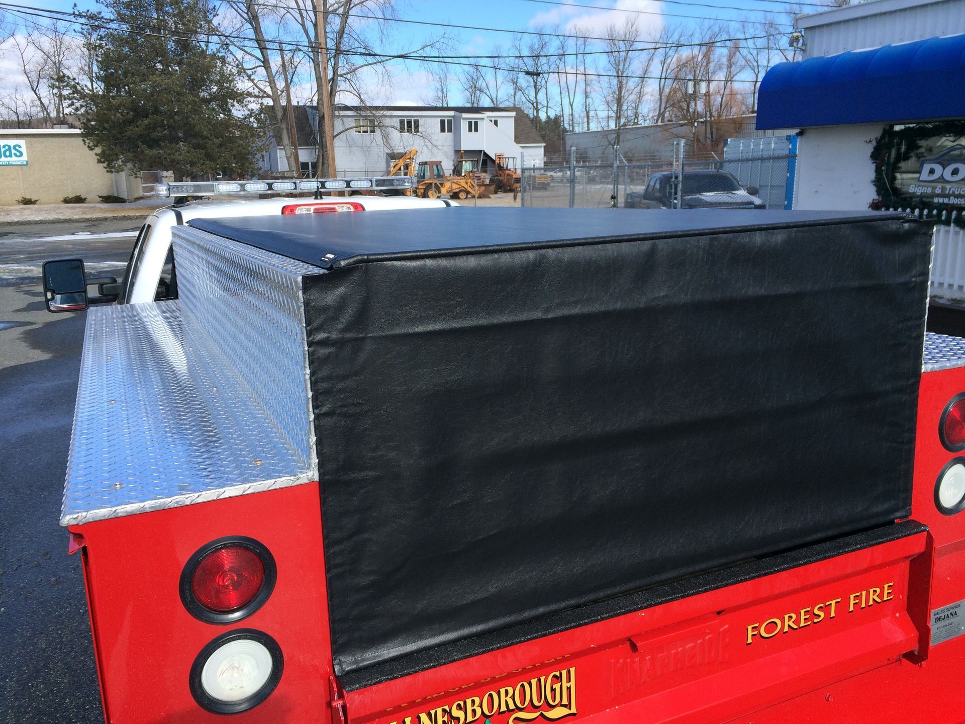A red truck with the word forest on the back