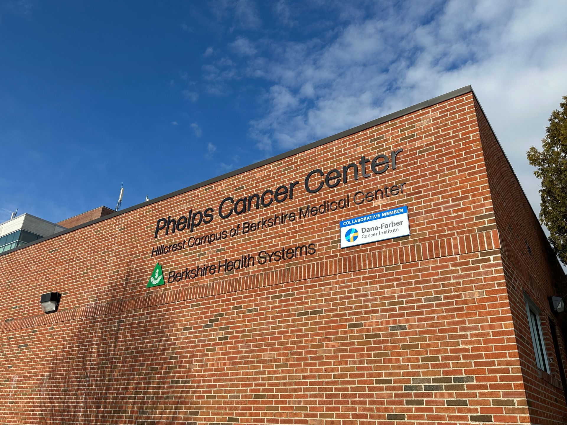 A brick building with the word cancer center written on it.