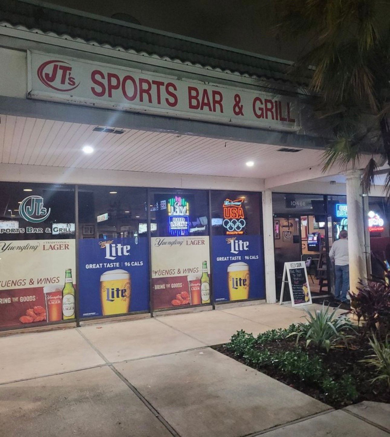 A sports bar with a sign that says sports bar & grill
