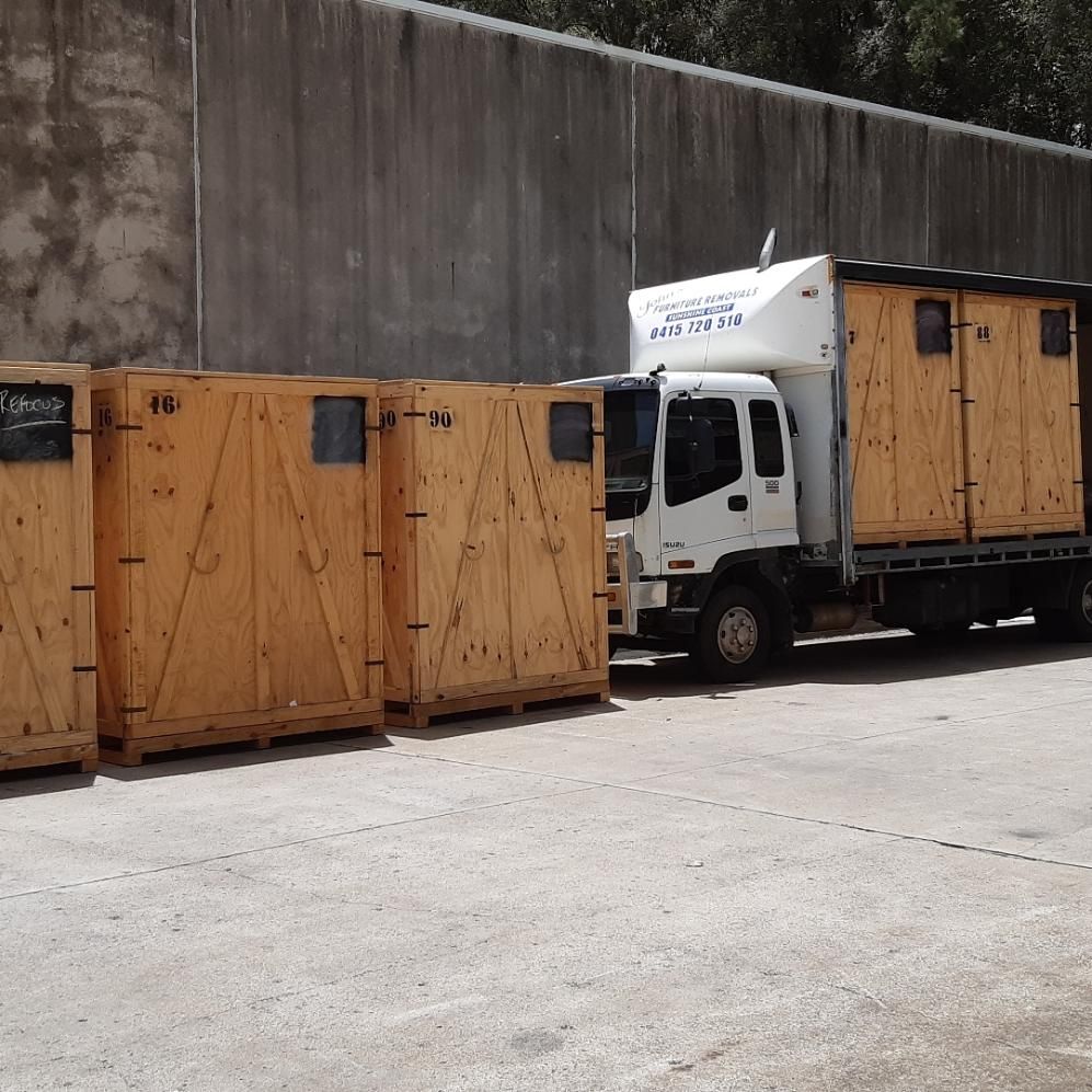 Wooden Crates Next to a Truck — John's Furniture Removals in Maroochydore, QLD