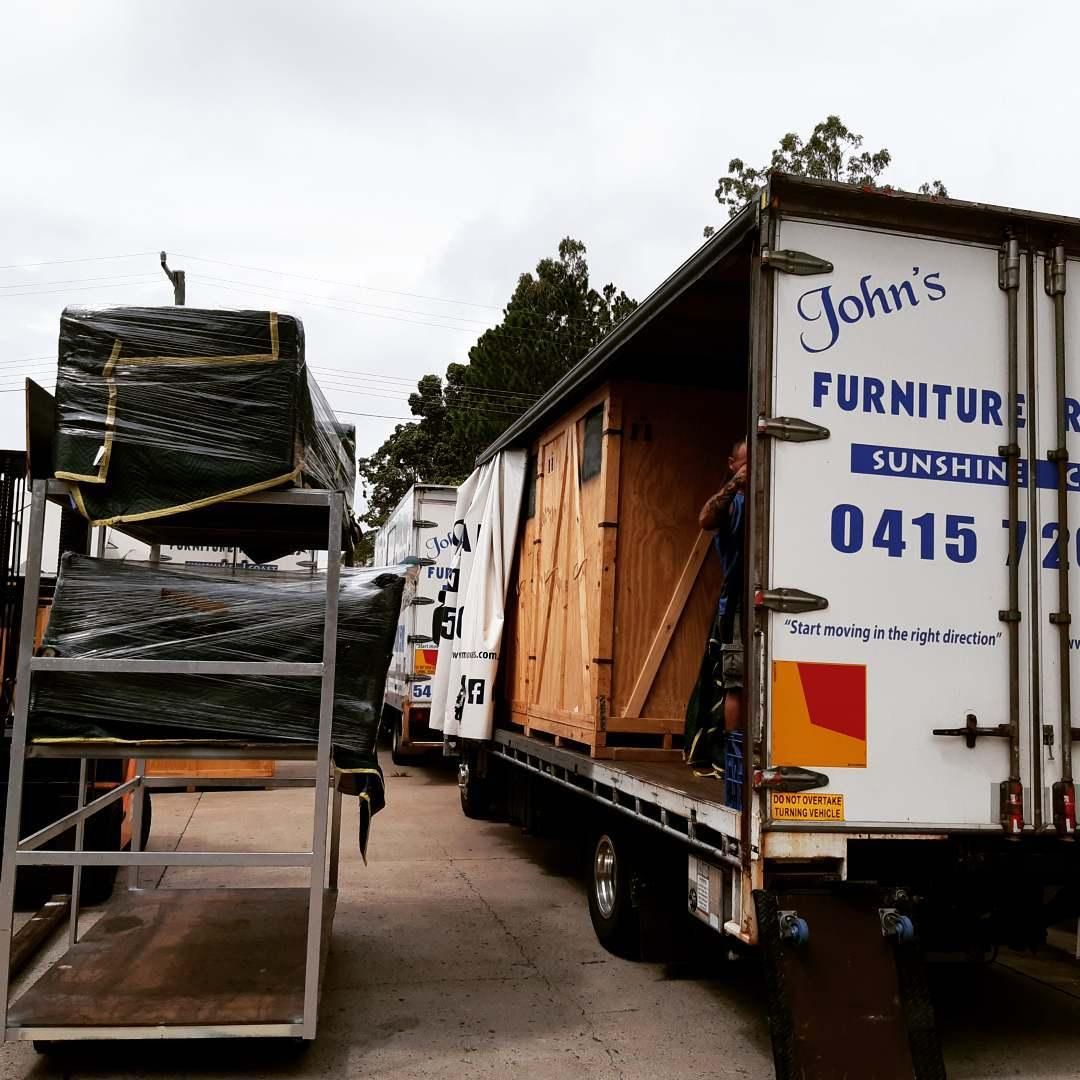 Movers Loading Furniture Onto Trucks for John's Furniture Removals in Sunshine — John's Furniture Removals in Brisbane, QLD