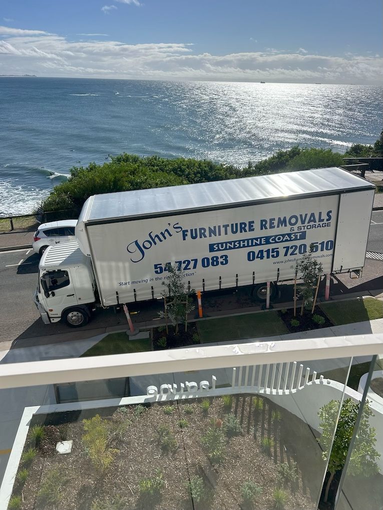 Removals Van Overlooking Beach — John's Furniture Removals in Yandina, QLD