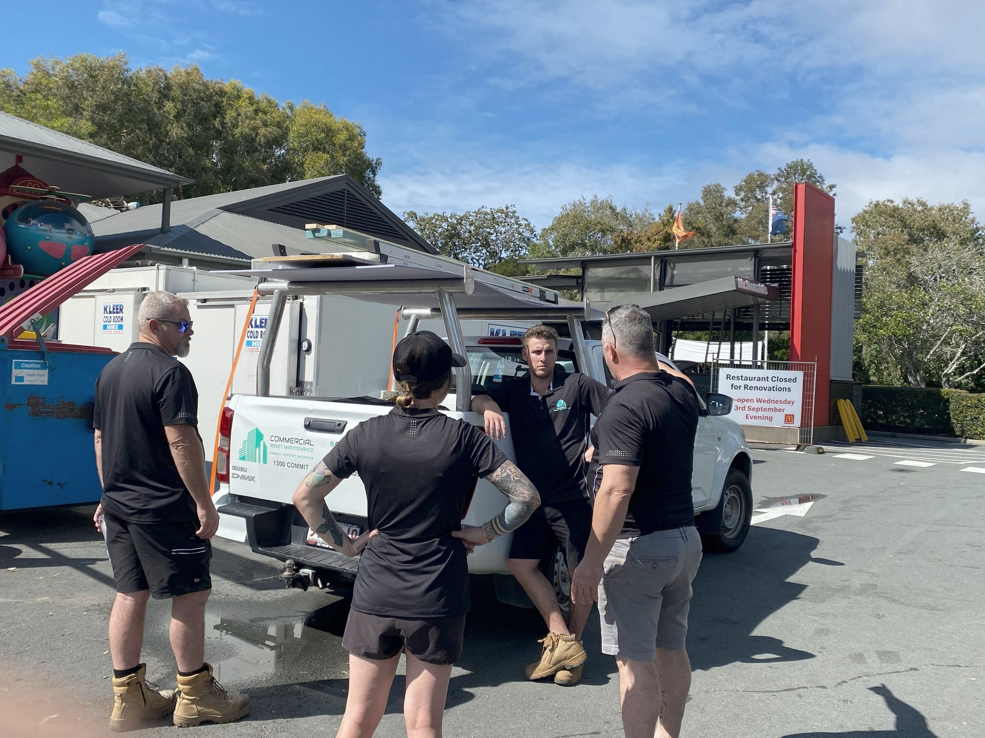 Five Workers Load a Truck — Commercial Asset Maintenance In Gold Coast, QLD