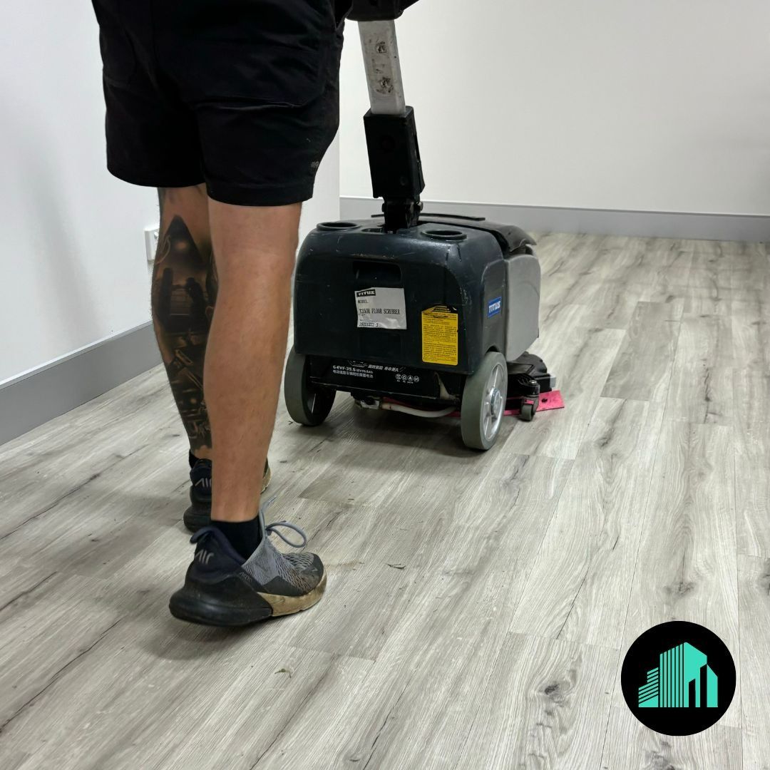A Person Operating a Floor Cleaning Machine — Commercial Asset Maintenance In Brendale, QLD