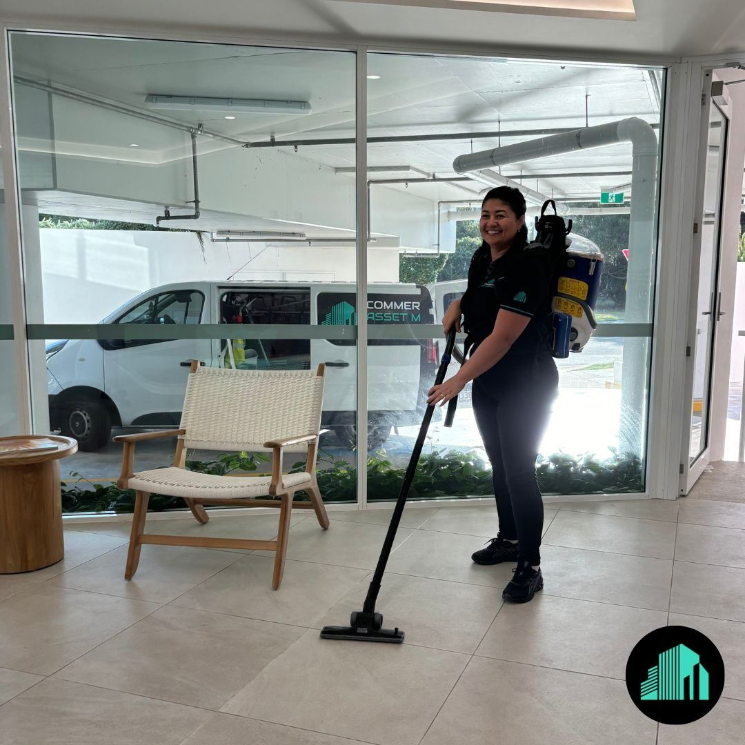 A Woman Vacuuming a Modern Space — Commercial Asset Maintenance In Brisbane, QLD