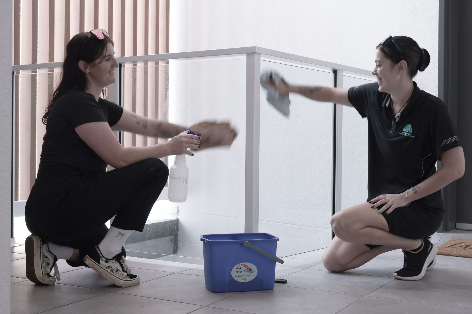 Two Women Cleaning a Building — Commercial Asset Maintenance In Noosa, QLD