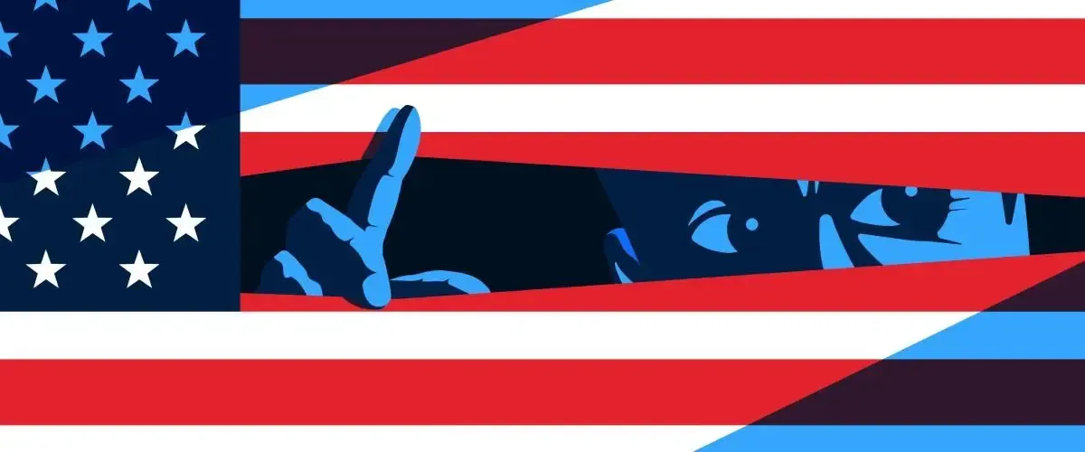 An american flag with a shadow of a person behind it.