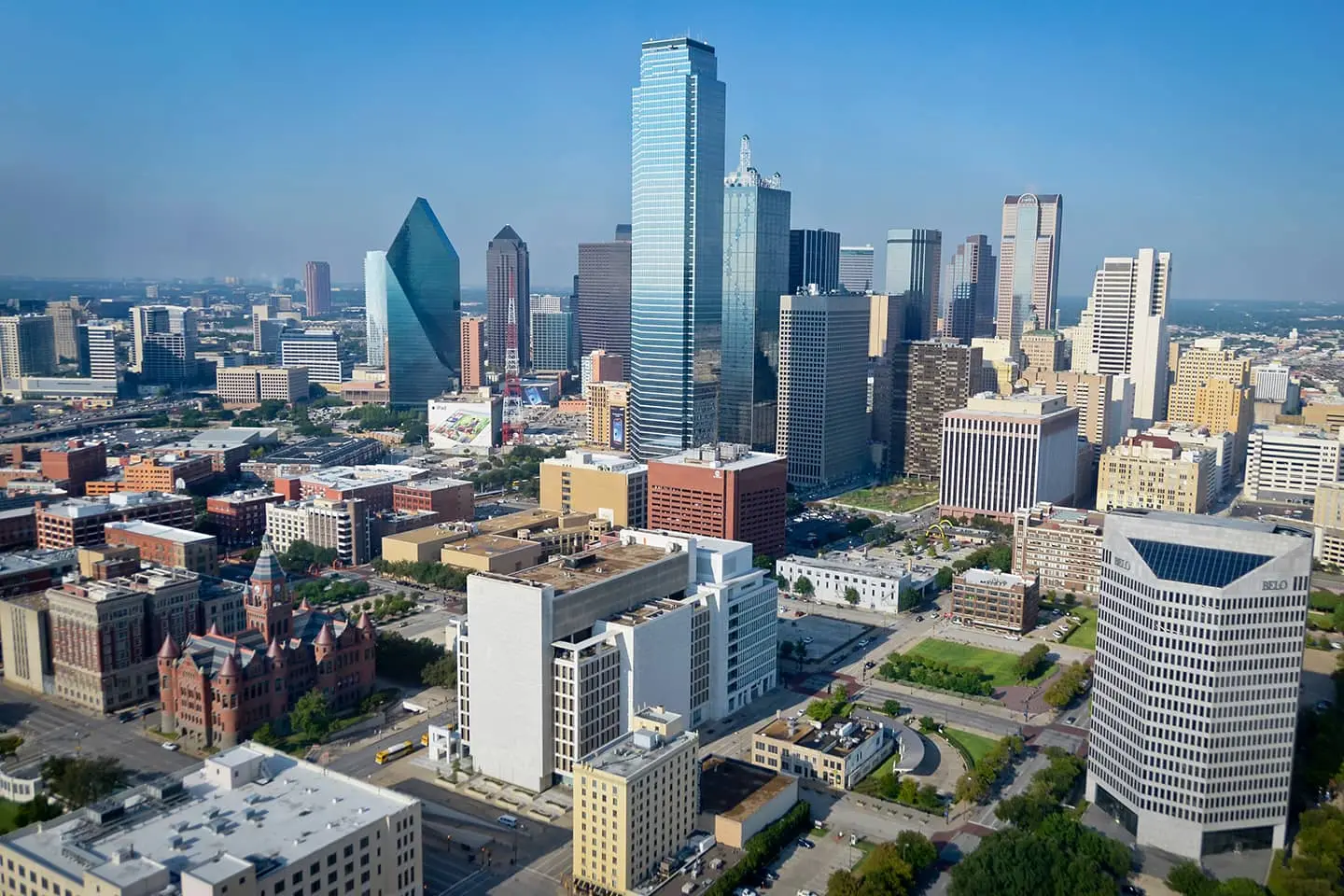An aerial view of a city with a lot of buildings and trees