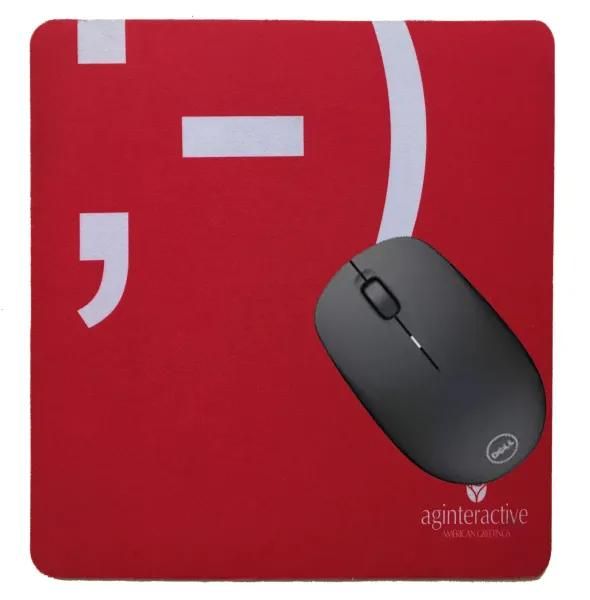 Red mousepad with a black wireless mouse on it