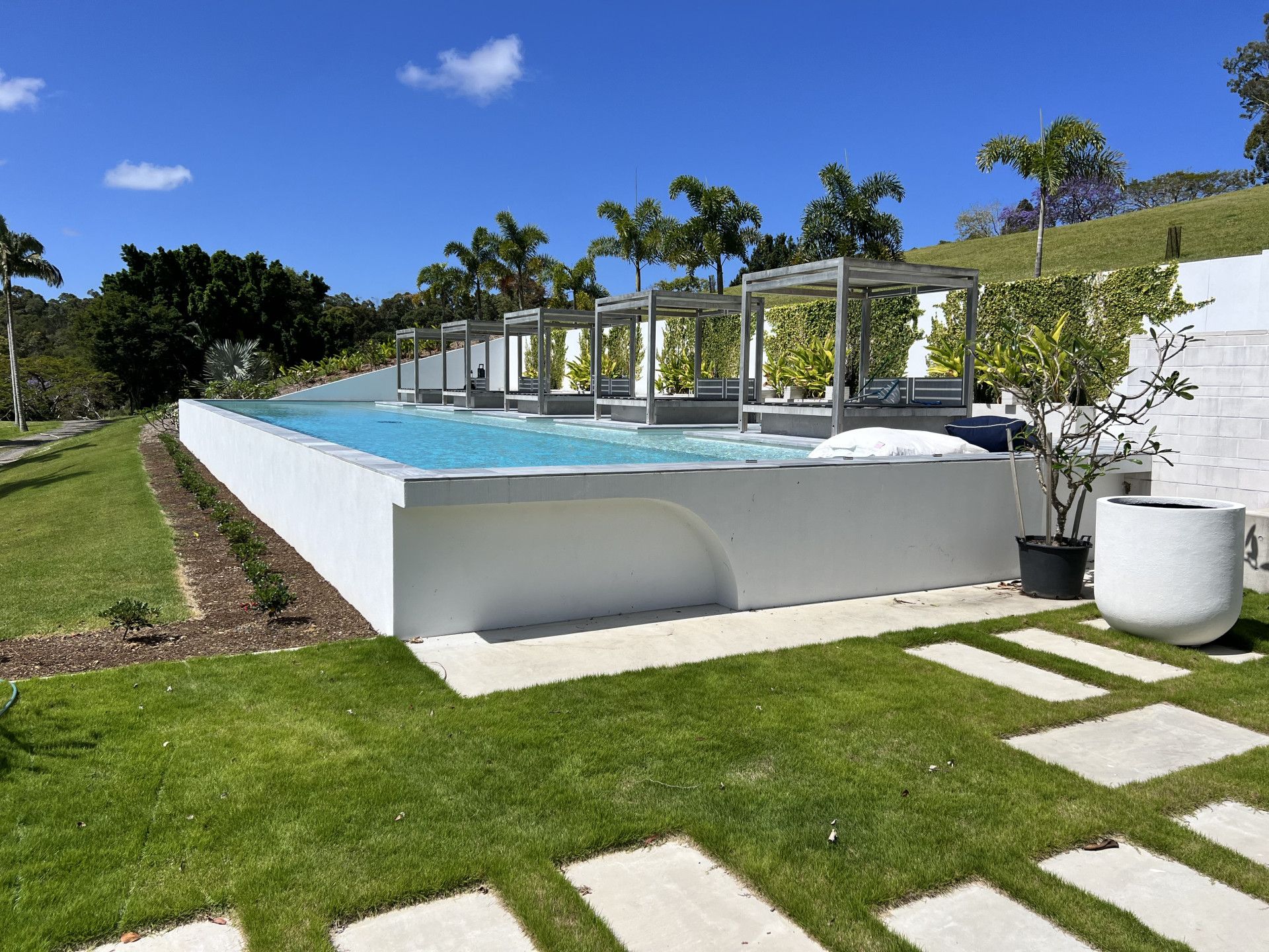 Modern Rectangular Pool With Cabanas, on a Grassy Hillside — Construction 33 in Maroochydore, QLD