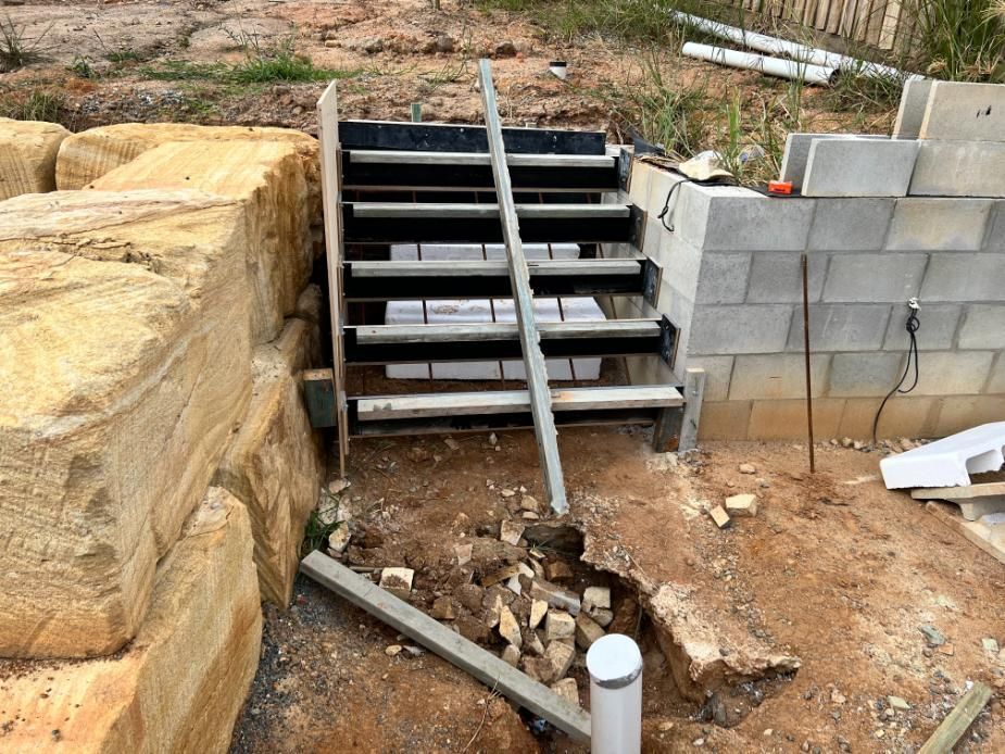Set of Stairs Are Being Built Next to a Brick Wall — Construction 33 in Maroochydore, QLD