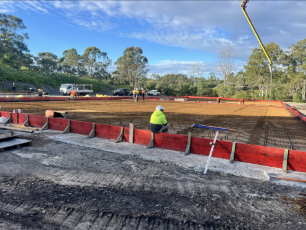 Room With Brick Walls and a Wooden Table With Tools on It — Construction 33 in Maroochydore, QLD