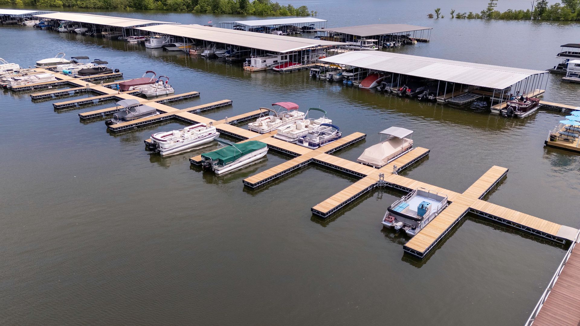 An aerial view of a marina filled with lots of boats.