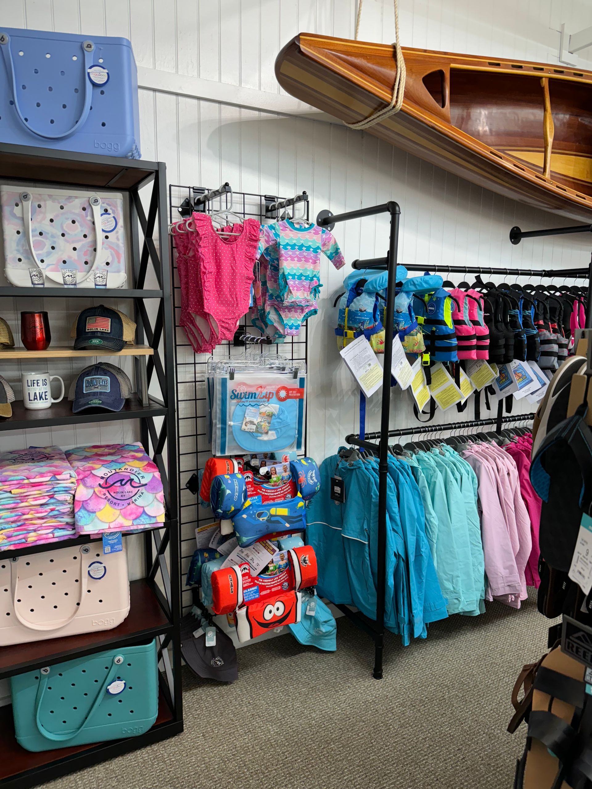A store filled with lots of clothes and bags.