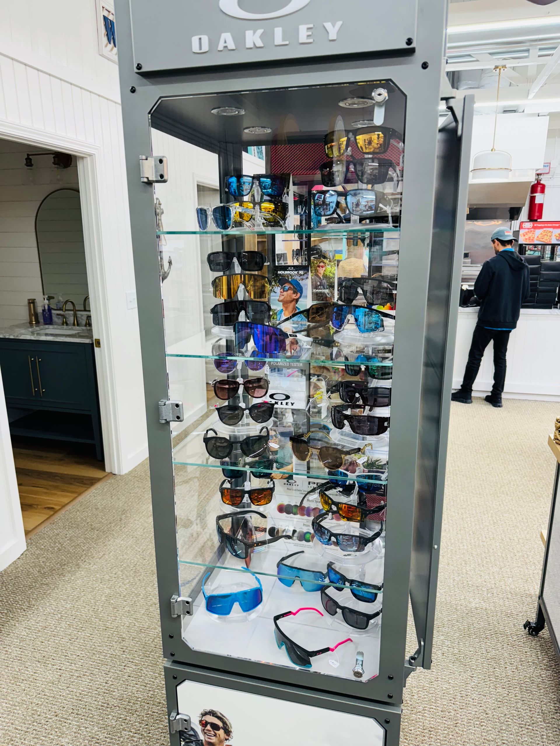 An oakley display case filled with sunglasses and goggles