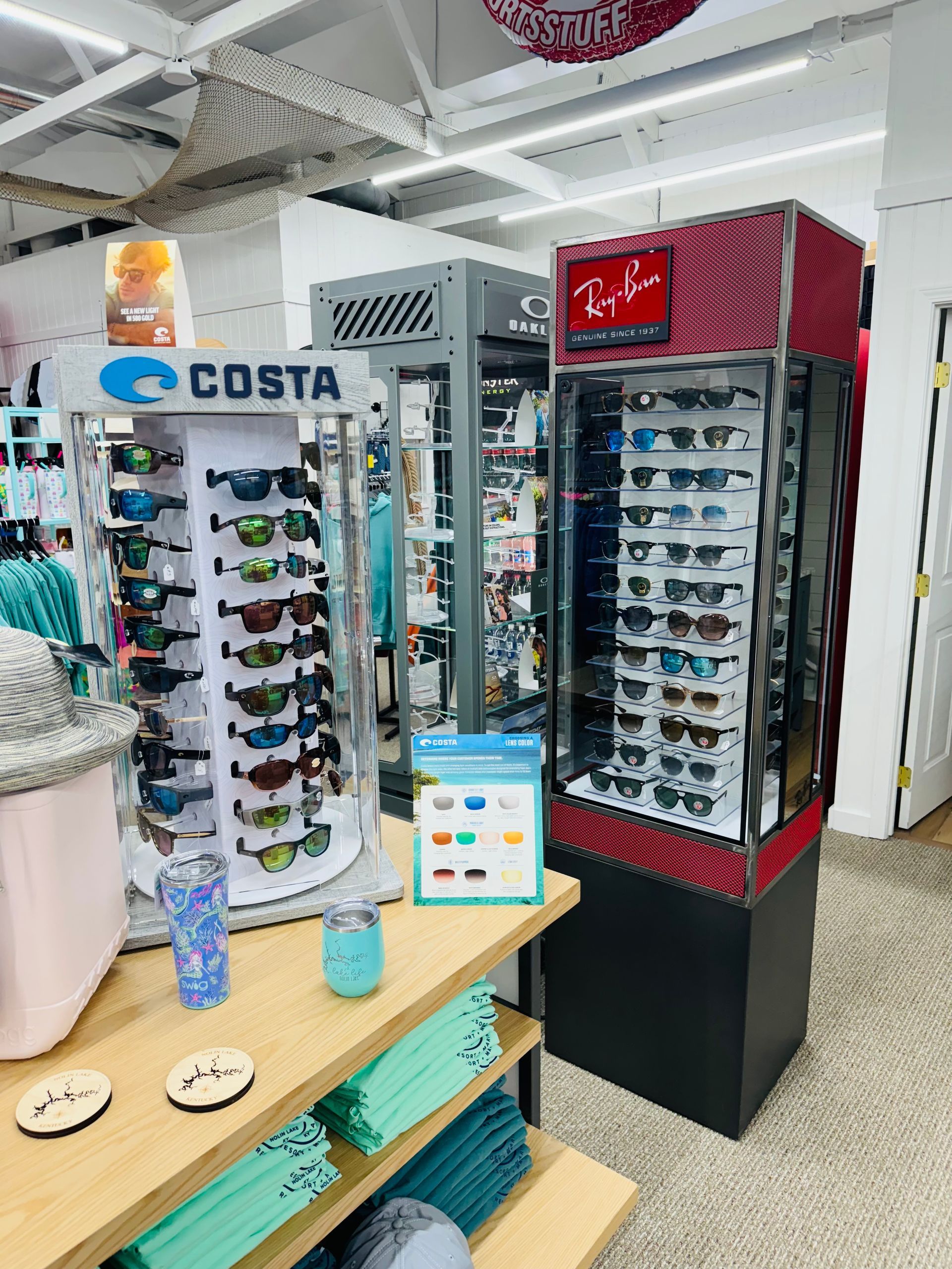 A store filled with lots of sunglasses on display.