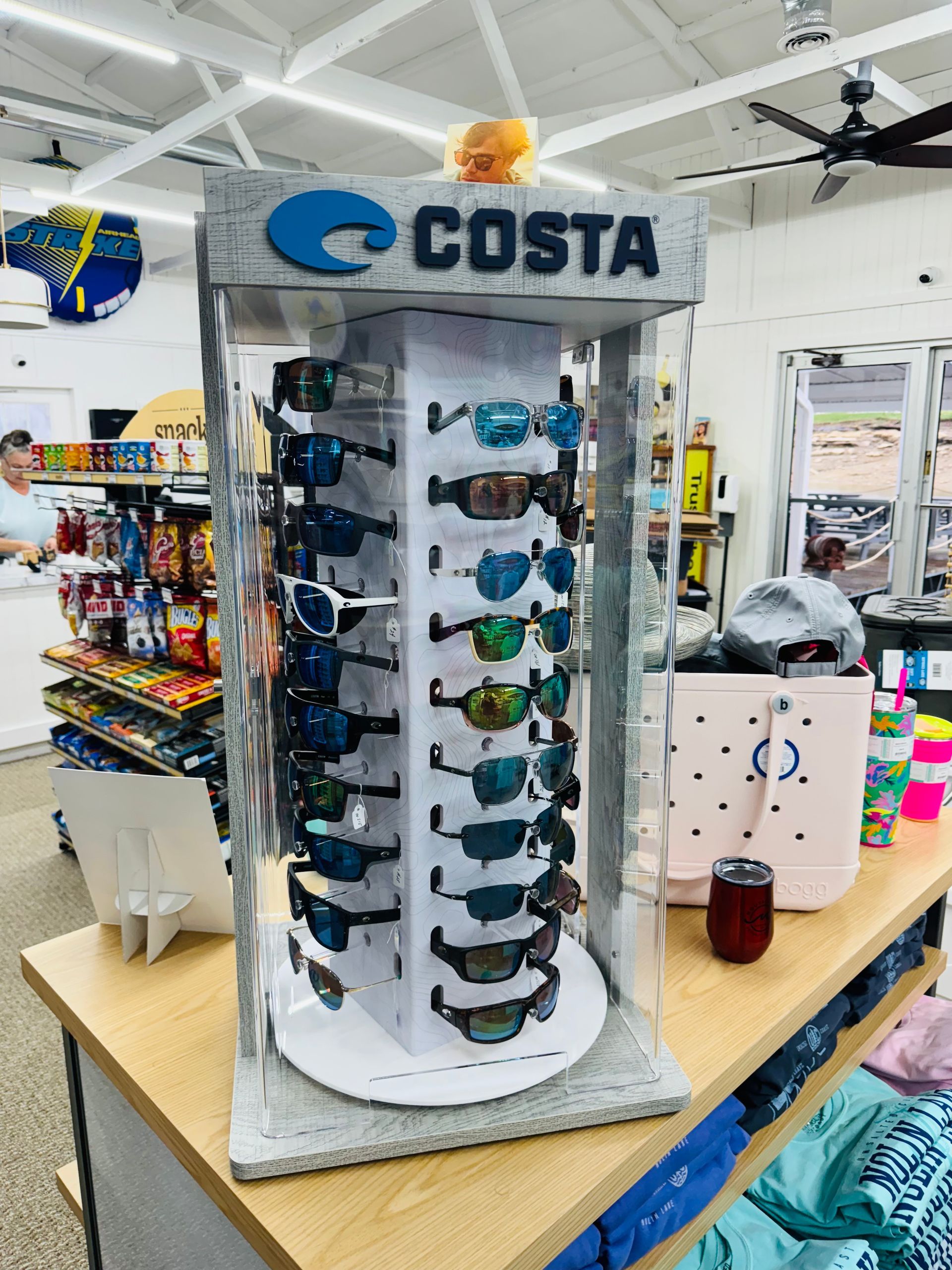 A display of costa sunglasses in a store