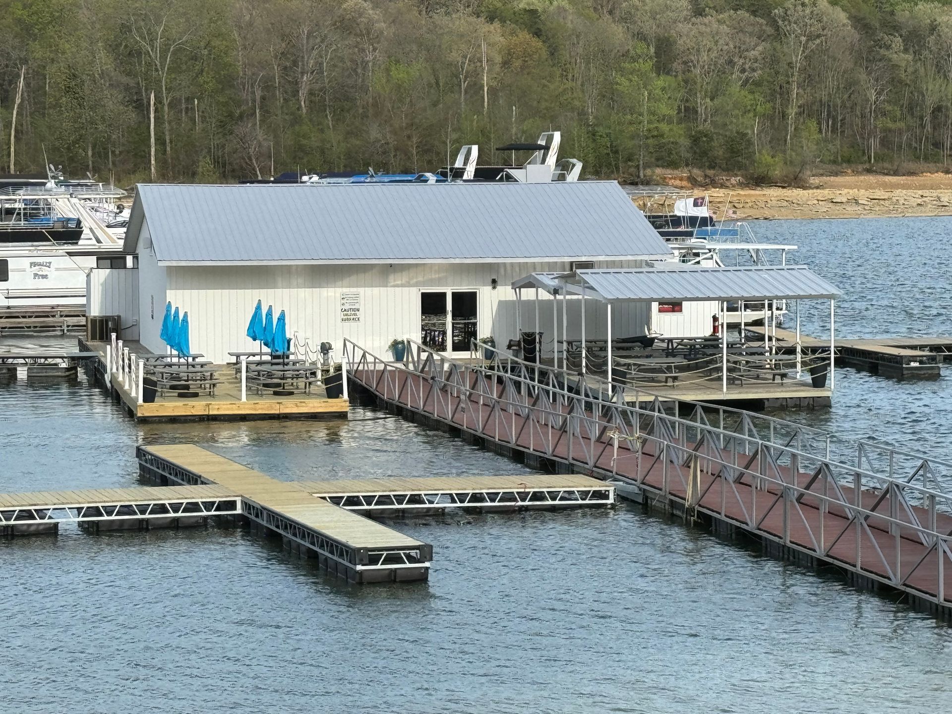 A large white building sits in the middle of a body of water